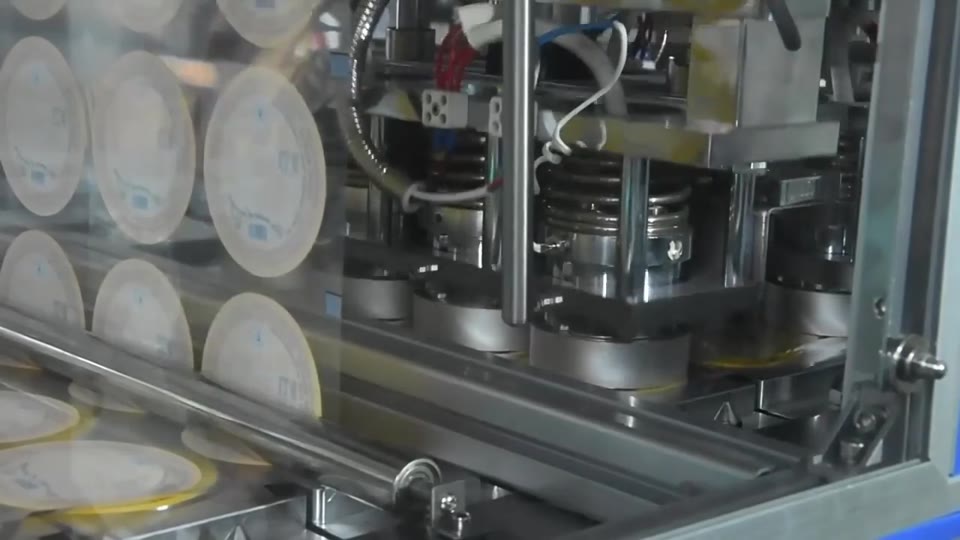 Cup filling and foil sealing — V012