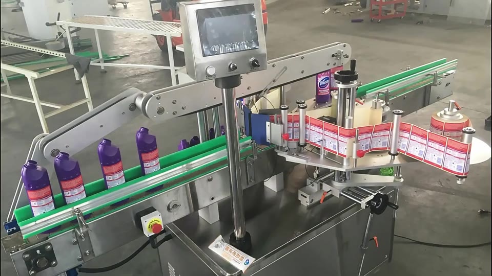 Conveyor bottle labeling — V016